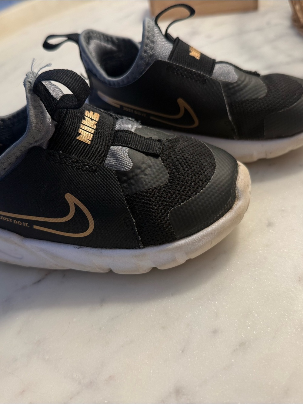 Nike Kids Black and Gold Slip-On Sneakers